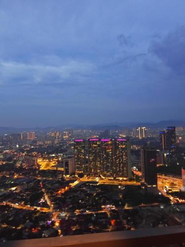a view of a city at night at My Residence Villa Star Klcc in Kuala Lumpur