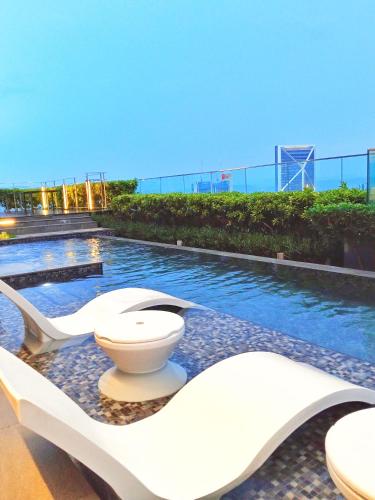 a swimming pool with a toilet on top of a building at My Residence Villa Star Klcc in Kuala Lumpur