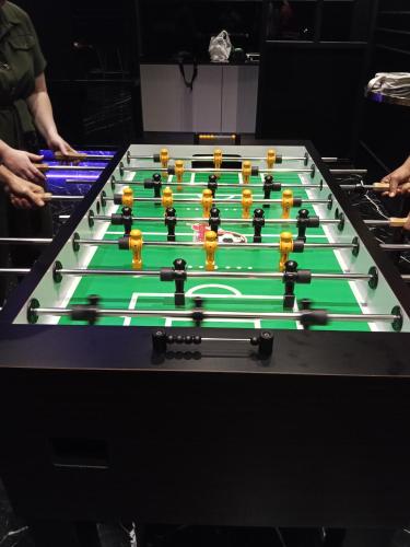 a group of billiard tables with green at My Residence Villa Star Klcc in Kuala Lumpur