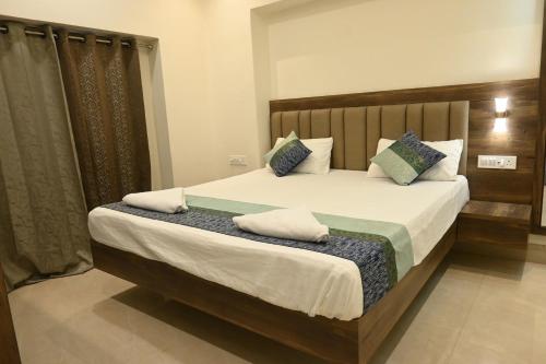 Postel nebo postele na pokoji v ubytování Manan Homestay