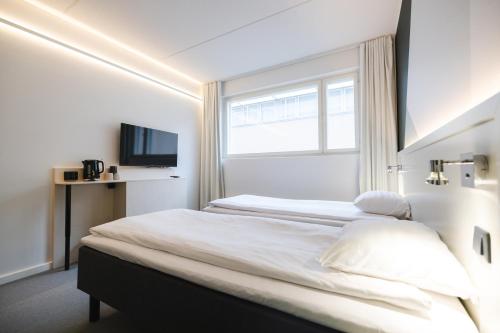 Katil atau katil-katil dalam bilik di GreenStar Hotel Joensuu