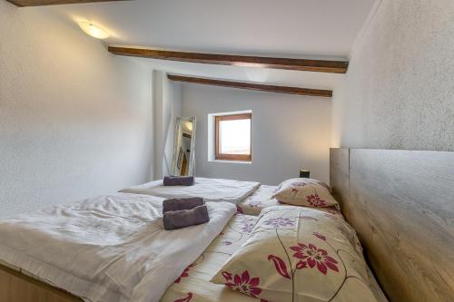 Postel nebo postele na pokoji v ubytování Old Town Apartments in Umag