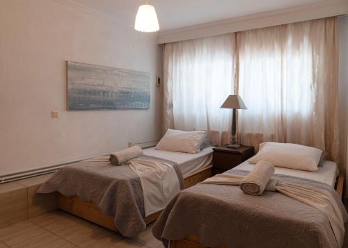Ένα ή περισσότερα κρεβάτια σε δωμάτιο στο Silot apartment 2