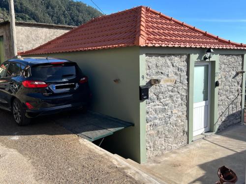a car parked in front of a building at Casa Morena - Private Tropical Oasis in Campanário