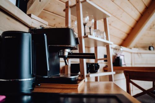 a coffee maker sitting on a counter in a kitchen at Osada Poli Koniaków - Panoramiczny Domek nr 3 z Prywatną Balią i Hydromasażem in Koniaków