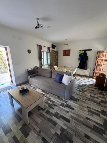 a living room with a couch and a coffee table at La Dama del Agua in Piedralaves