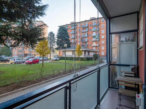 a balcony with a view of a parking lot at Tolstoi 83 Apartment in Milan