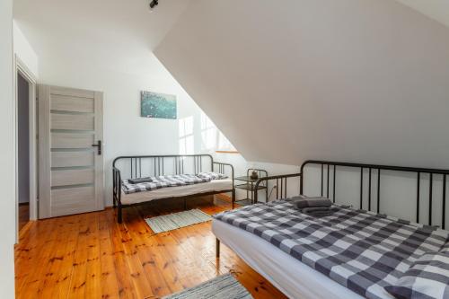 Ένα ή περισσότερα κρεβάτια σε δωμάτιο στο Bay House Puck