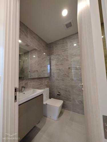 a bathroom with a toilet and a sink at Newly Decorated Condo Near Siam Paragon in Bangkok
