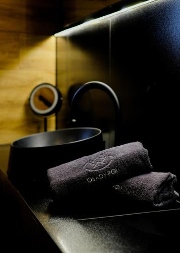 a towel sitting on a counter next to a sink at Osada Poli Koniaków - Panoramiczny Domek nr 3 z Prywatną Balią i Hydromasażem in Koniaków