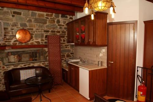 a kitchen with a sink and a counter top at Παραδοσιακός ξενώνας Ναϊάς in Zagora