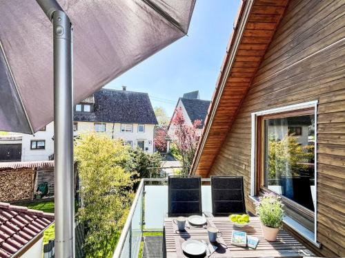 a patio with a table and chairs on a balcony at Apartment Land in Sicht by Interhome in Rulfingen