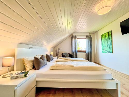 a large bed in a room with a ceiling at Apartment Land in Sicht by Interhome in Rulfingen