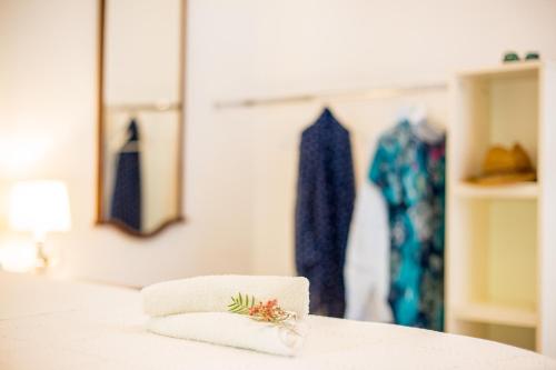 a pile of towels sitting on top of a counter at Apartments - House Monarch - beach, center & shared pool access in Sutivan