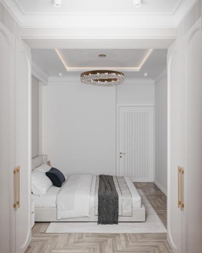 a bedroom with white walls and a bed in a room at Apartment in Muruntau