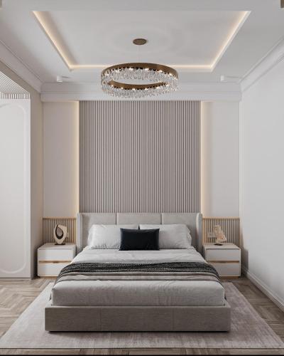 a bedroom with a large bed and a chandelier at Apartment in Muruntau