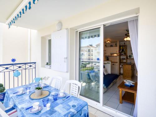 a dining room with a table and a view of a room at Apartment Terrasses de Pontaillac by Interhome in Pontaillac