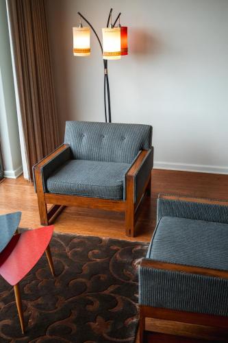 a living room with a couch and a chair at Schulphoek Seafront House in Hermanus