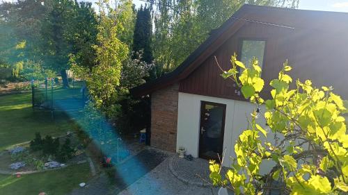 a house with a garden and a house at TOSKANA Nadarzyn in Nadarzyn