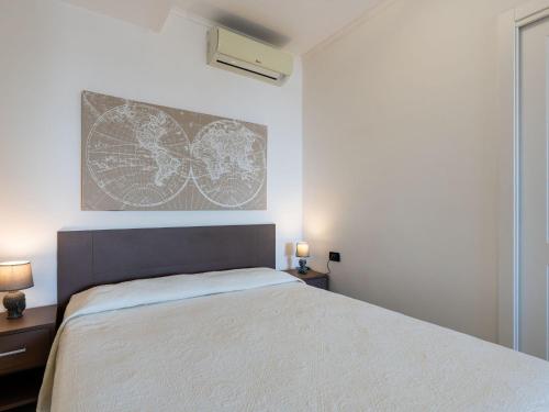Postel nebo postele na pokoji v ubytování Apartment Romina by Interhome