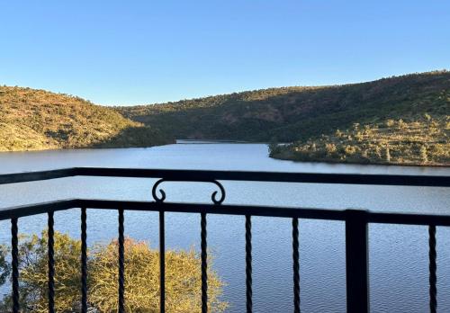 a view of a river with mountains in the background at Fish Eagle Manor in Warmbaths