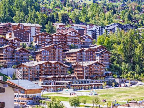 a large group of buildings in a mountain town at Apartment Le Refuge 1 by Interhome in Nendaz