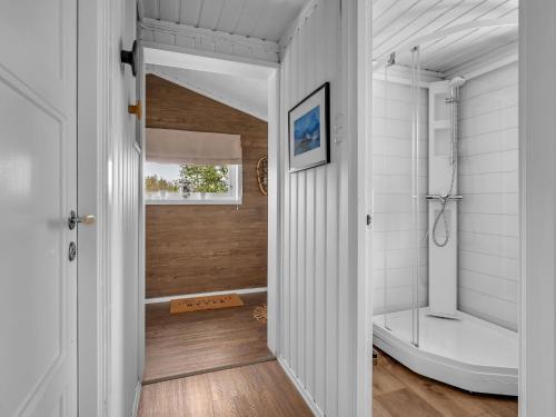 a bathroom with a shower and a toilet in a room at Chalet Knøttebu by Interhome in Øyuvstad