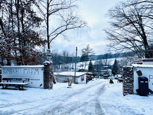 a snow covered street with a snow covered road at Tiny Ferienhaus 4 am Rimbach in Steinau an der Strasse in Steinau an der Straße
