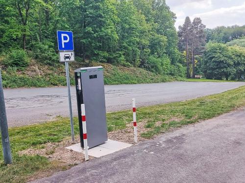 a parking meter on the side of a road at Holiday Home Sorgenfrei by Interhome in Frankenau