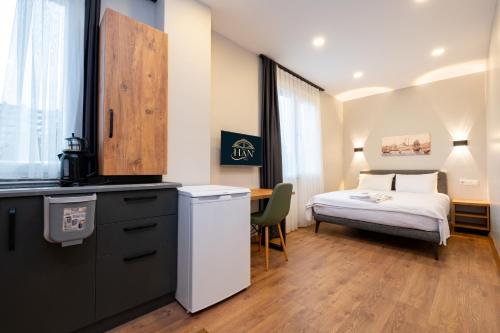 a hospital room with a bed and a table at The Han YK Hotel in Avcılar