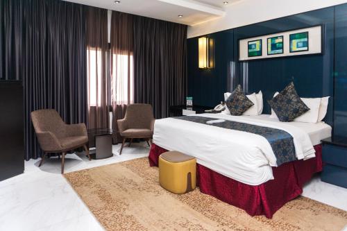 Ένα ή περισσότερα κρεβάτια σε δωμάτιο στο GreenPoint Hotel