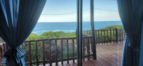 a view of the ocean from a balcony at Xai Xai Mozambique, Fish Eagle, Xai Xai Beach Front in Xai-Xai