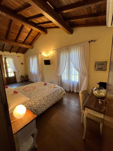a bedroom with a bed and two windows at Casale Antica Cassia Beauty Spa in Rome