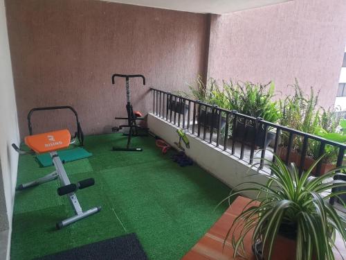 a balcony with a treadmill and a gym at French Suite Cordero, amazing view, internet veloz in Quito