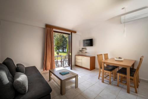a living room with a couch and a table at Maistra Select Villas Rubin Resort in Rovinj