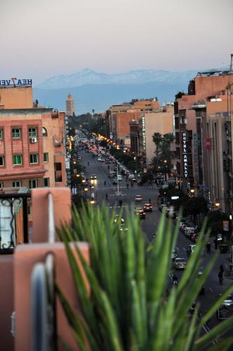 a view of a city street with cars and buildings at Mont Gueliz in Marrakech