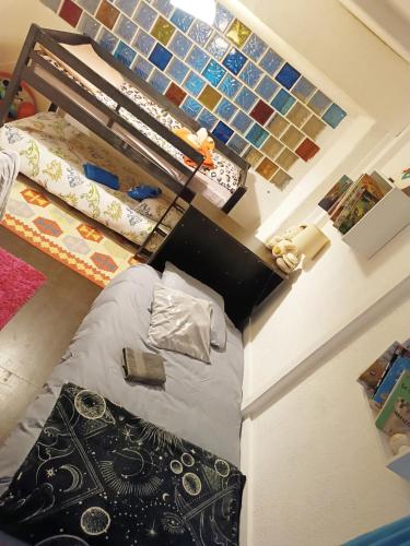 a room with a bed in a room with a staircase at Maison chaleureuse à Capendu avec cheminée et jardin in Capendu