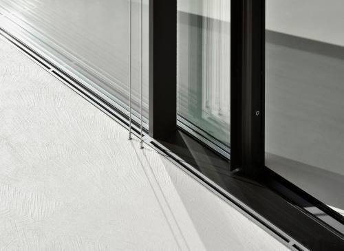 a window on the side of a building at Mirror Houses in Bolzano
