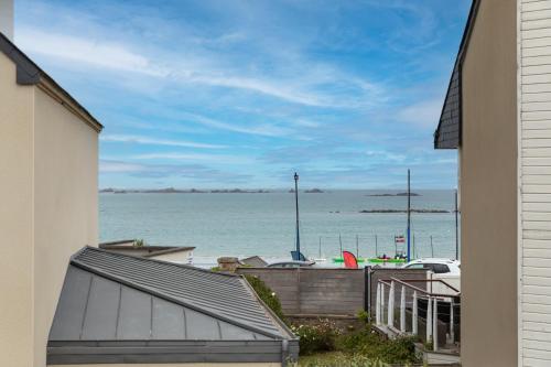a view of the ocean from a house at Villa Ker Jade - vue sur la mer in Lancieux