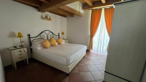 A bed or beds in a room at Il Mulino di Hotel Villa Aurora