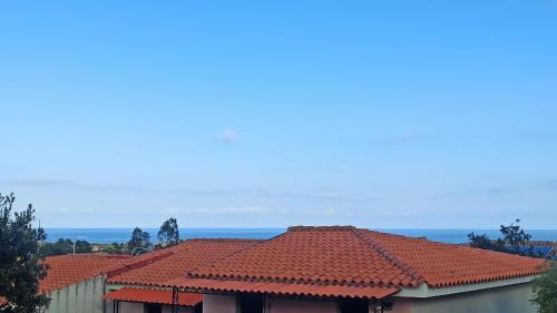 a group of houses with red tile roofs at Casa Maggy in Budoni