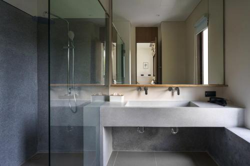 a bathroom with a sink and a mirror at Modern 3 Bdr Villa Tree O'Clock Bangtao With a Pool in Ban Pak Lak