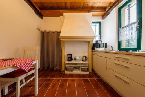 a kitchen with an oven in the middle of it at Urlaub im historischen Pesthäuschen in Xanten