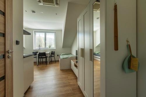 a room with a kitchen and a dining room at Restaurace Hotel Praha in Nižbor