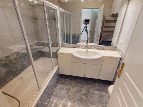 a bathroom with a sink and a shower and a toilet at Superbe 2P centre Menton avec terrasse, clim, Wi-Fi - FR-1-196-152 in Menton