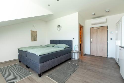 a bedroom with a bed in a room at Restaurace Hotel Praha in Nižbor