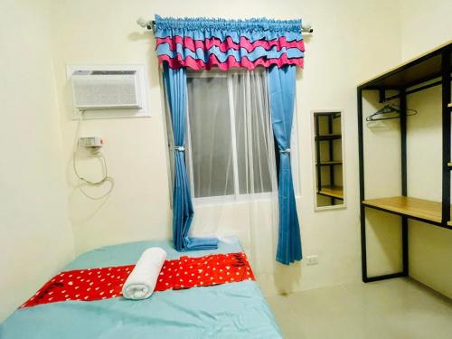 Postel nebo postele na pokoji v ubytování Staycation House in Dauis, Panglao