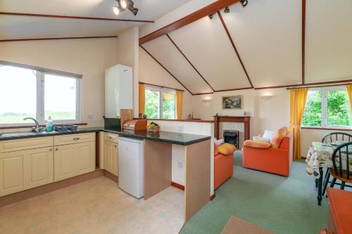a kitchen with a sink and a counter top at Dinmor in Penmon