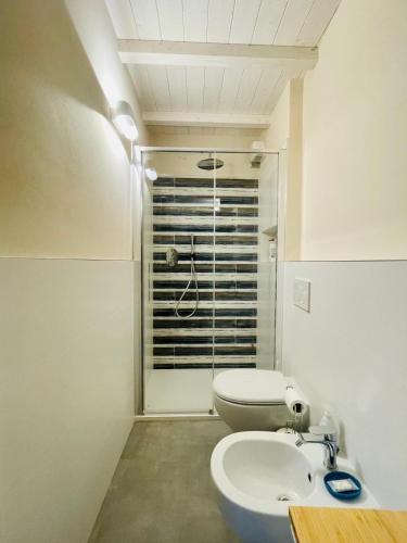 a bathroom with a toilet and a sink and a shower at La Gritta in Lerici