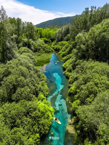 an aerial view of people kayaking down a river at La Locanda Del Castello in Ocre